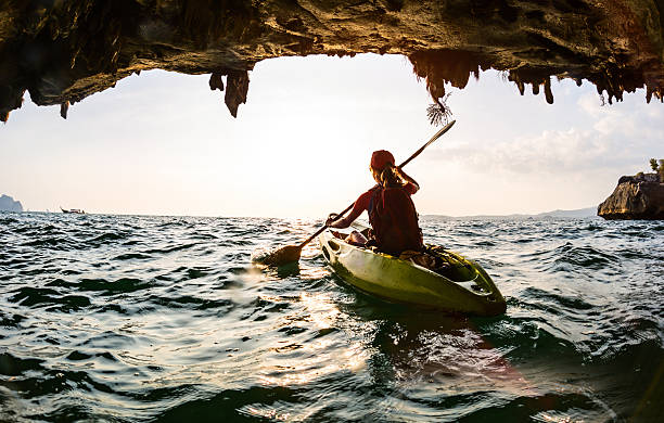 istock Young lady paddling the kayak 607258592