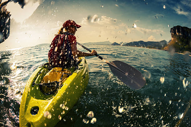 istock Young lady paddling the kayak 607259482