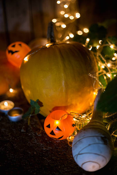 istock Halloween pumpkin head jack lantern on wooden background 607259554