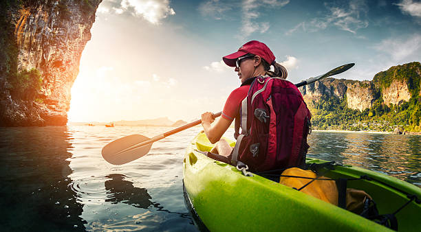 istock Young lady paddling kayak 607261596