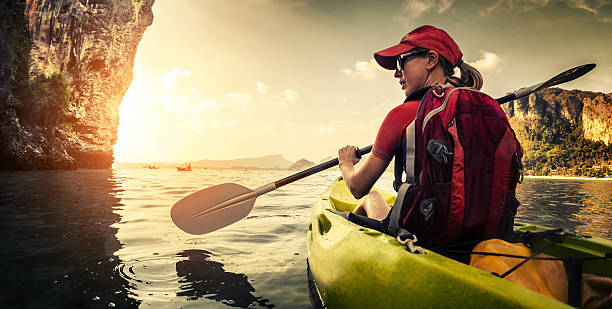 istock Young lady paddling kayak 607261932