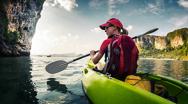 istock Young lady paddling kayak 607262140