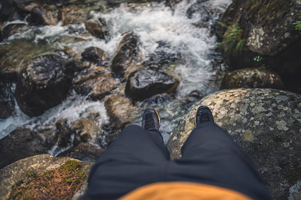 The feet of a young woman immersed in the river
