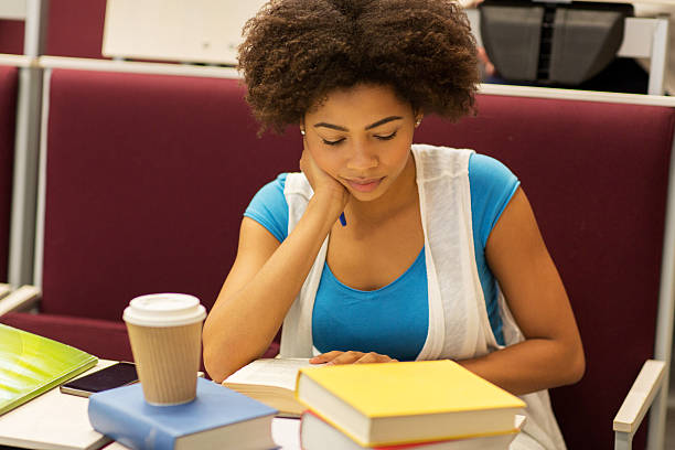 istock student girl with books and coffee on lecture 607263804