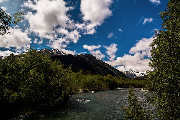 istock Mountain River amid the snowy peaks 607265838