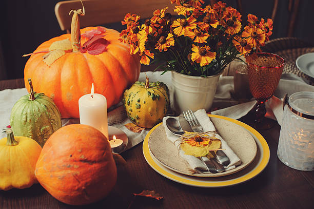 istock autumn traditional seasonal table setting at home with pumpkins 607267834