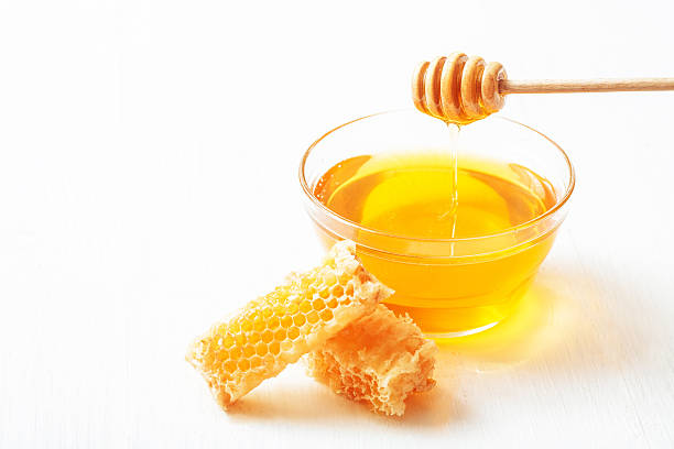 istock Honey with and wooden spoon 607267958