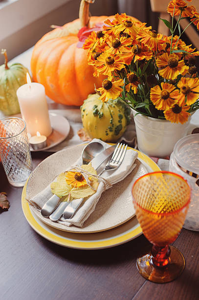istock autumn traditional seasonal table setting at home with pumpkins 607268038