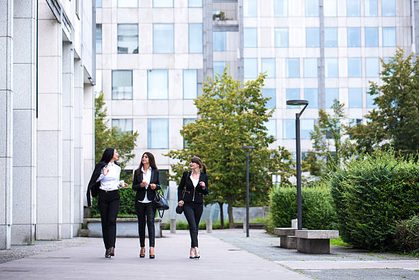istock Businesswomen in a park 607268804