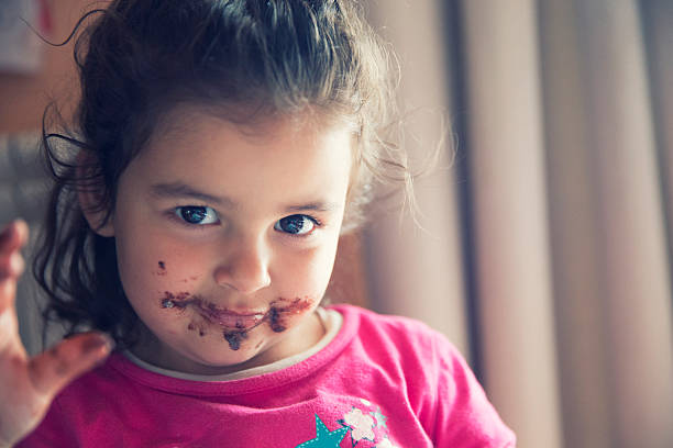 istock Girl with dirty mouth 607271510