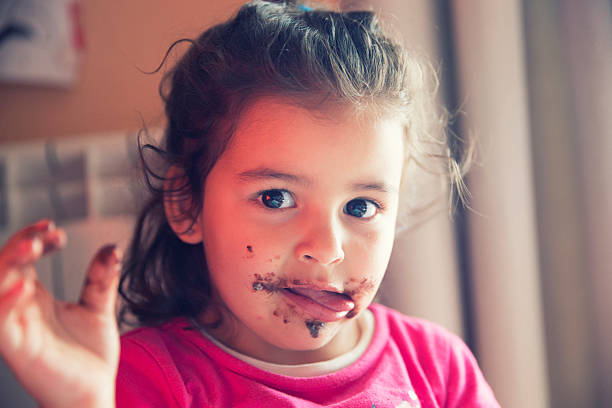 istock Girl with dirty mouth 607271612