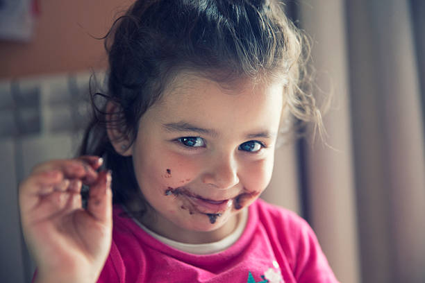 istock Girl with dirty mouth 607271692