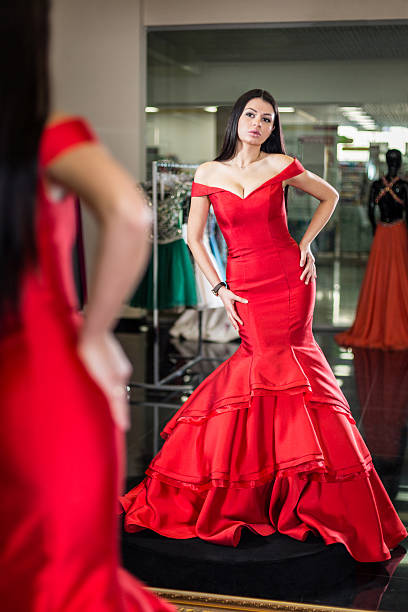 istock girl posing in a dress 607271714
