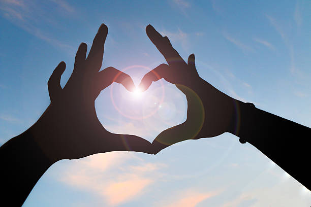 istock Human hand showing love sign 607272436
