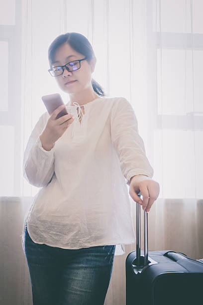 istock Businesswoman work at hotel room 607273292
