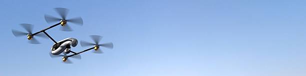 istock Drone Quadrocopter  in flight at blue sky panorama 607273396