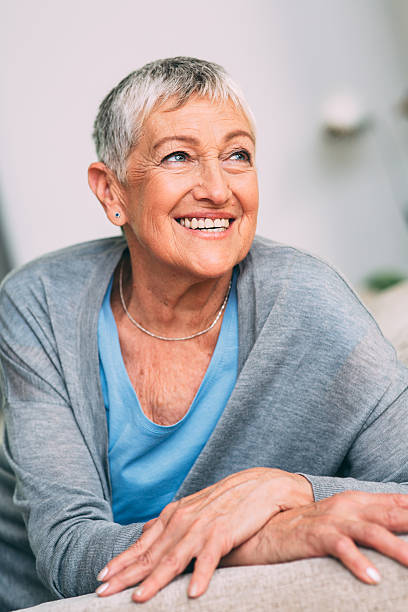istock happy senior woman 607273512