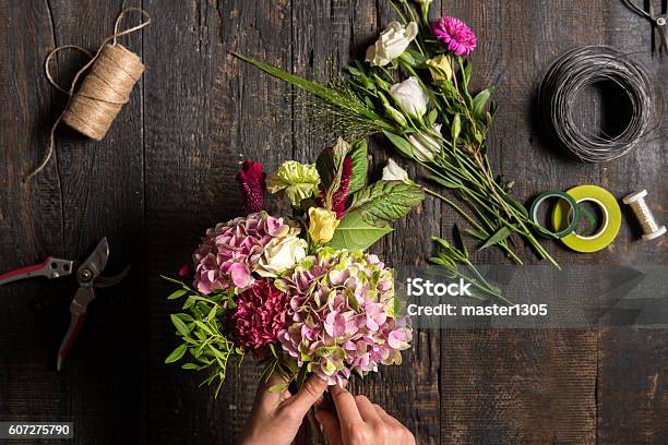 The Florist Desktop With Working Tools And Ribbons Stock Photo - Download Image Now - Flower, Workshop, Florist