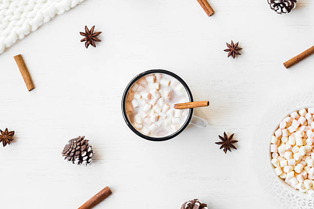 istock Hot chocolate, cinnamon sticks, anise star, marshmallow, knitted blanket 607276766