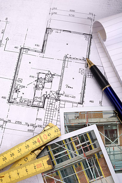 istock Photos and folding ruler on top of a blueprint 607279108