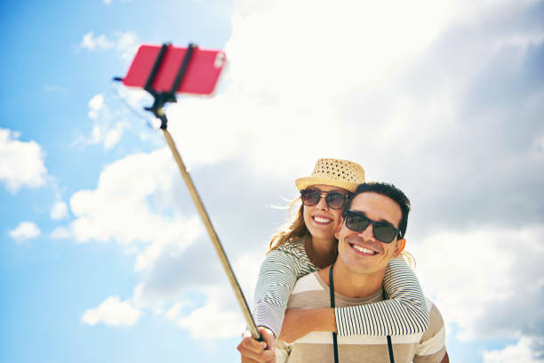 istock Young woman enjoying a piggy back ride 607279798