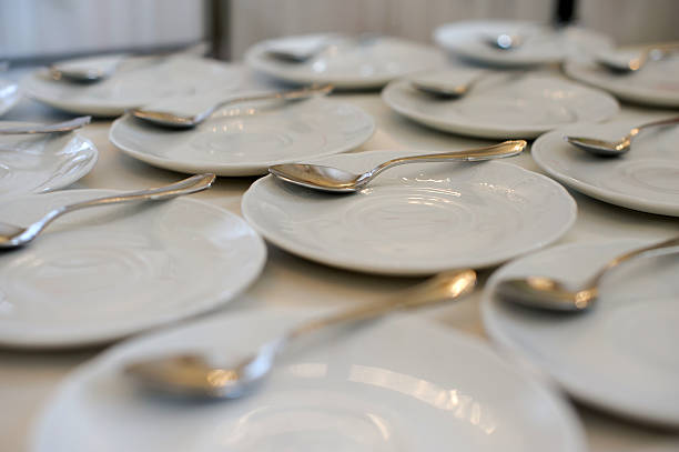 istock White saucer and spoon for tea  coffee. 607281734