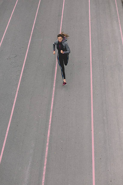 istock Sports woman jogging outside 607282500
