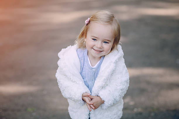 istock young family walking in the park 607283534