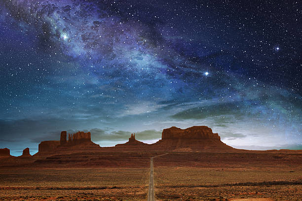 monument valley under a night starry sky scenic route to the monument valley under a night starry sky mesa photos stock pictures, royalty-free photos & images