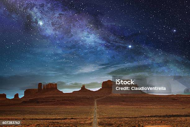 Monument Valley Under A Night Starry Sky Stock Photo - Download Image Now - Arizona, Landscape - Scenery, Night