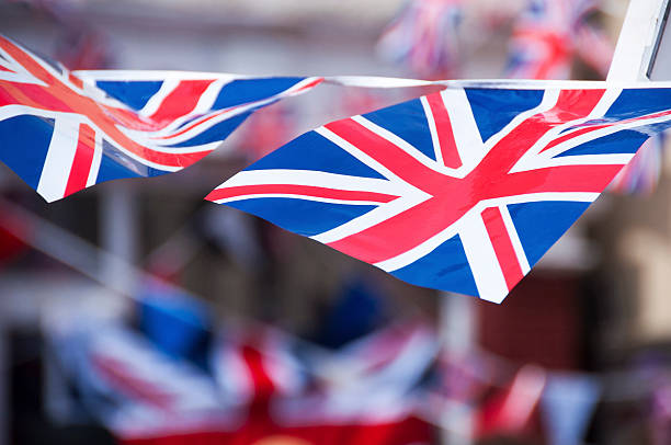 Flying the flag Union Jack flag bunting flying in the the wind british culture stock pictures, royalty-free photos & images
