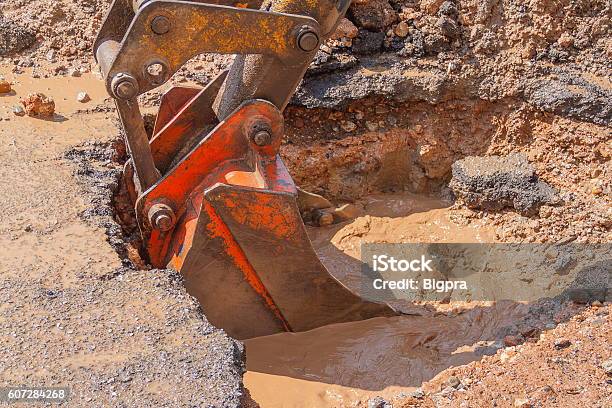 Excavator Working The Repair Of Pipe On Road Stock Photo - Download Image Now - Agricultural Machinery, Backhoe, Bulldozer