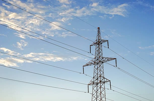 istock Electricity pylon against the blue sky background. 607284608