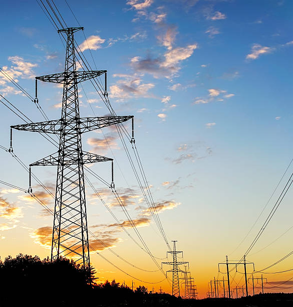 istock Electricity Pylon - standard overhead power line transmission t 607284674