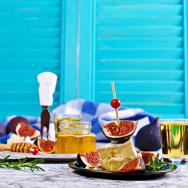 istock Pieces of Camembert and figs 607285496