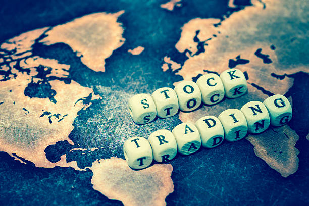 istock STOCK TRADING on grunge world map 607285514