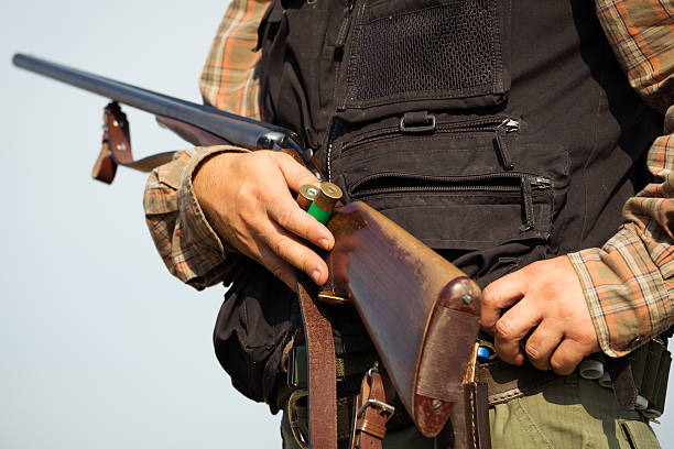 istock Close-up of a hunter loading his shotgun 607288026