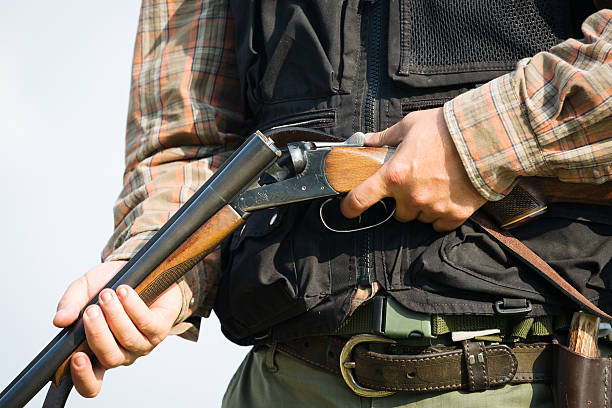 istock Close-up of a hunter loading his shotgun 607288204