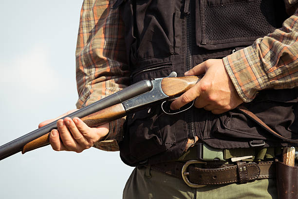 istock Close-up of a hunter loading his shotgun 607288314