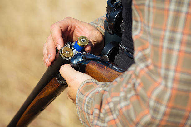 istock Close-up of a hunter loading his shotgun 607288386