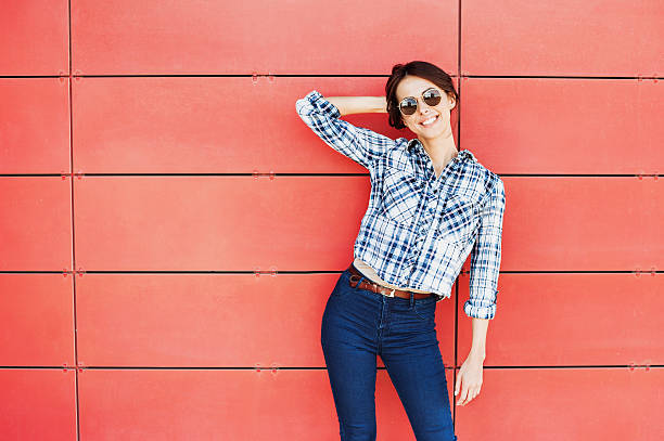 istock Smiling young woman outdoors 607288462