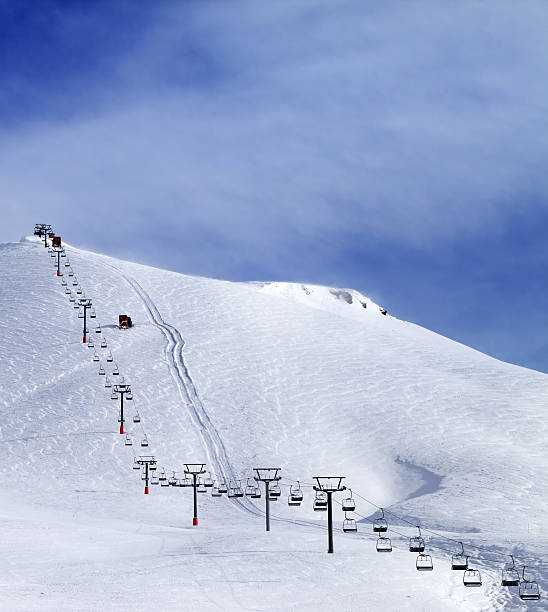 istock Ski slope and chair-lift at morning 607292122