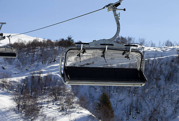 istock Close-up view on chair-lift in ski resort 607292176