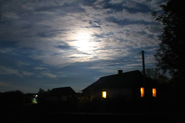 istock Rural house at night in full moon light 607292342
