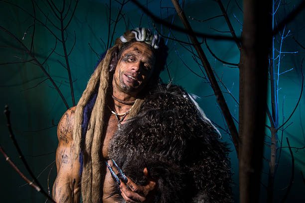 istock Muscular man with skin and dreadlocks among 607292926