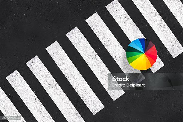 Top View Of A Rainbow Umbrella On A Pedestrian Crosswalk Stock Photo - Download Image Now