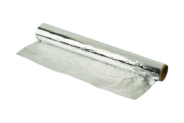 istock aluminum foil roll on the white background 607294104