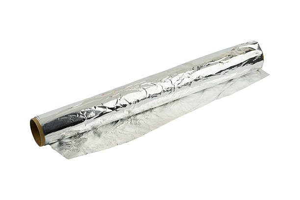 istock aluminum foil roll on the white background 607294772