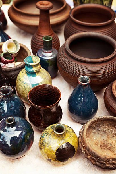 istock Lots of handmade earthenware. Ceramic pots, vases at pottery shop 607296620