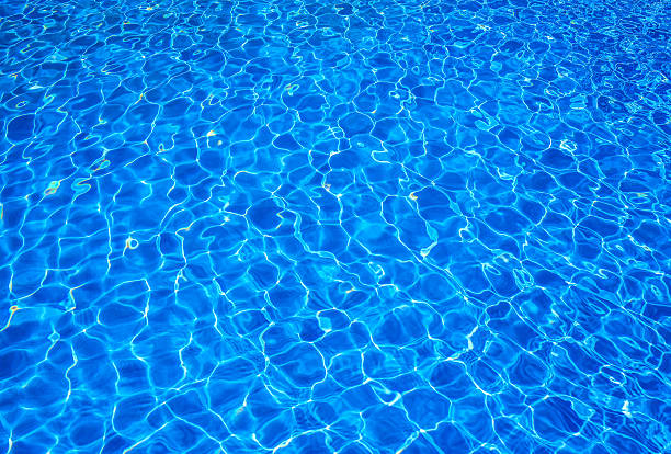 istock Sunlit water in a water pool 607297120